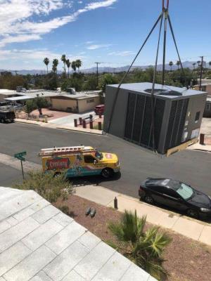Hauling an AC unit to a rooftop