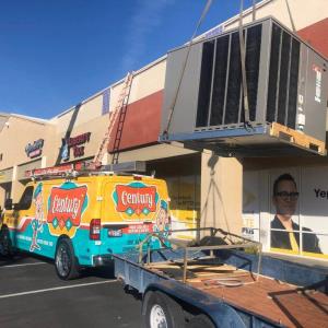 Hauling an AC unit to a rooftop