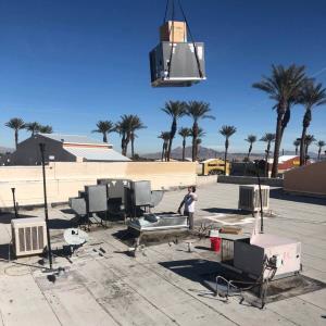 Hauling an AC unit to a rooftop